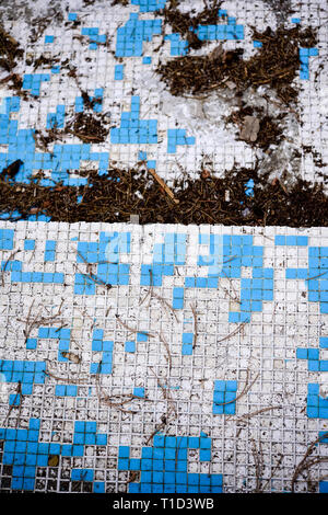 Broken blue azure  retro tiles mosaic in abandoned pool - Berengaria Hotel, Cyprus Stock Photo