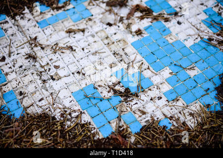 Broken blue azure  retro tiles mosaic in abandoned pool - Berengaria Hotel, Cyprus Stock Photo