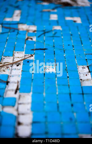 Broken blue azure  retro tiles mosaic in abandoned pool - Berengaria Hotel, Cyprus Stock Photo