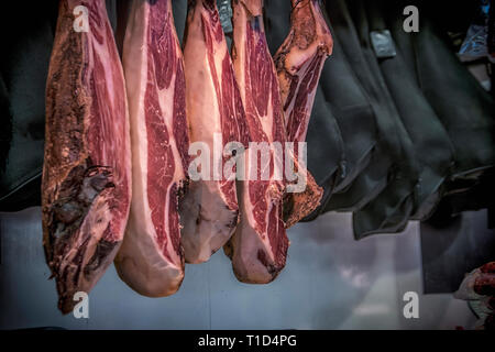Traditional dry-cured Spanish ham at the marketplace Stock Photo