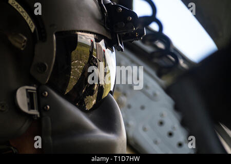 A special missions aviator from the 41st Rescue Squadron (RQS) aims the .50 caliber machine gun mounted to an HH-60G Pave Hawk, Aug. 17, 2018, at Patrick Air Force Base, Fla. Airmen from the 41st RQS and 41st Helicopter Maintenance Unit traveled to Patrick AFB to participate in a spin-up exercise. During the exercise, Airmen faced scenarios and situations they may encounter downrange. (U.S. Air Force photo by Senior Airman Janiqua P. Robinson) Stock Photo