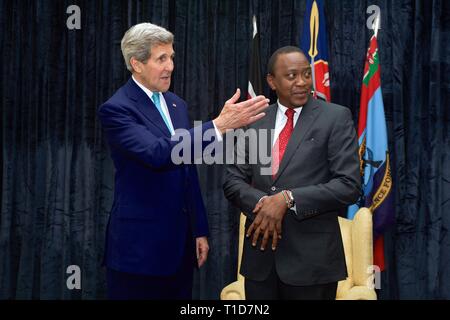 U.S. Secretary of State John Kerry talks with Kenyan President Uhuru Kenyatta before a meeting in Nairobi, Kenya on May 4, 2015. Stock Photo