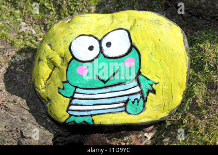 Colourful Frog Painted on A Rock - Wirral Rocks Stock Photo