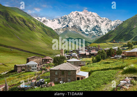 Stone medieval Svaneti tower houses of Chvibiani with mount Shkhara (5193m) behind, Ushguli, Upper Svaneti, Samegrelo-Zemo Svaneti, Mestia, Georgia.   Stock Photo