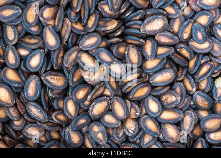 Heap of dried watermelon seeds close-up in a chinese street market in Chengdu Stock Photo