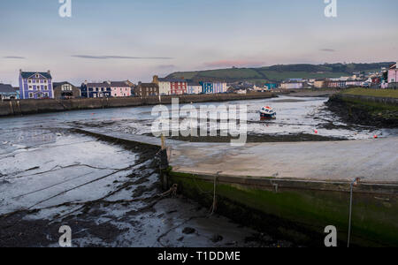 A single boat, in Aberaeron harbour, on the west coast of Wales Stock Photo