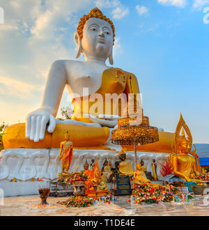 Huge statue of seated Buddha at What Phra That Doi Kham in Chaing Mai Stock Photo