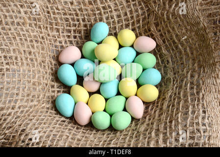 Closeup top view easter candy eggs in nest Stock Photo