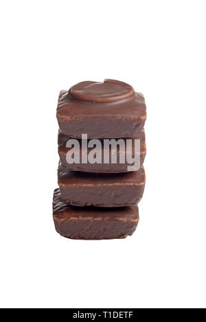 isolated stack of chocolate covered small cakes Stock Photo