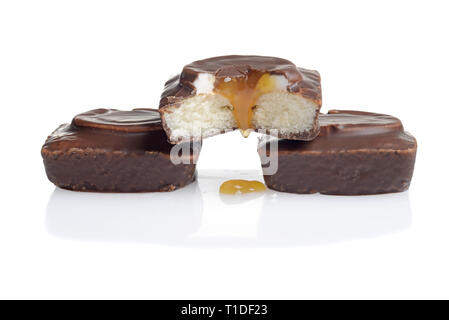 small chocolate vanilla cake dripping caramel Stock Photo