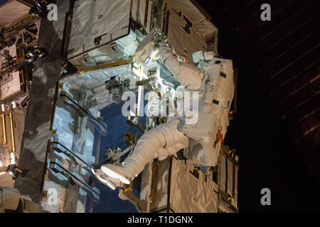 Expedition 59 NASA astronaut Nick Hague works on the power supply during a spacewalk outside the International Space Station March 22, 2019 in Earth Orbit. Astronauts McClain and Hague spent six-hours and 39-minutes outside the space station to upgrade the orbital complex's power storage capacity. Stock Photo