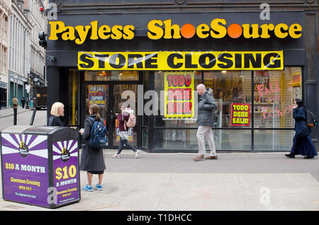 Payless Shoe Source store closing with people in motion on sidewalk in Downtown Crossing Boston, Massachusetts USA Stock Photo