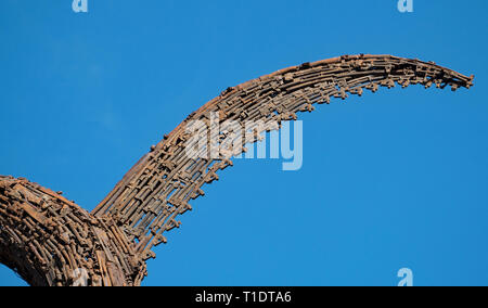 Cambodia monument to peace. Close up detail of a statue made of old weapons. Constructed in the shape of a mythical serpent, or Naga. 03-12-2018 Stock Photo