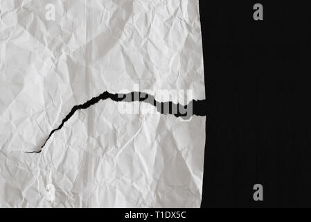 Crumpled and torn white paper texture Stock Photo