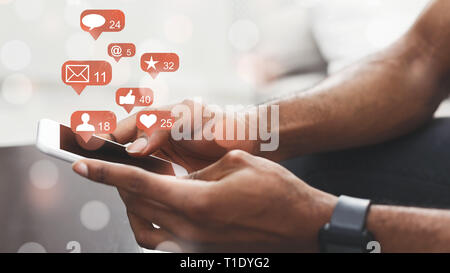 Social media. Man holding smartphone, connecting to internet Stock Photo