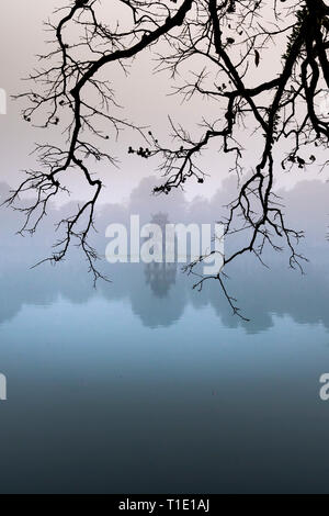 Hoan Kiem Lake ( Ho Guom) in the center of Hanoi in the fog in the morning. Hoan Kiem Lake is a famous tourist place in Hanoi Stock Photo