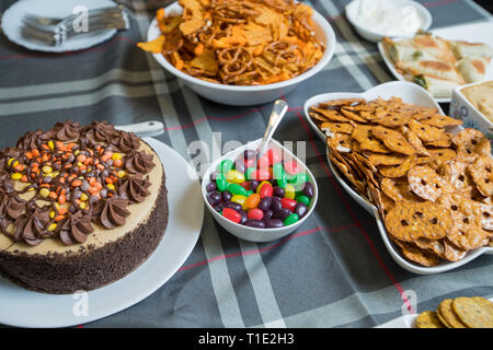 Various candies and snacks on table top, cake and candy Stock Photo