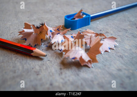 A pencil sharpened with a sharpener with pencil peels. Other pencil nib broken Stock Photo