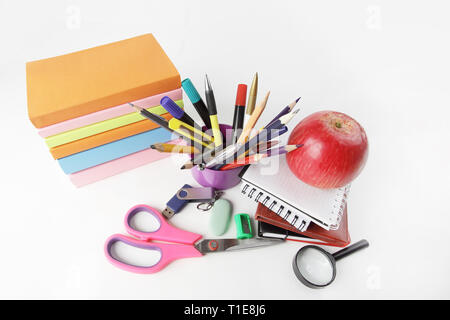 stack of books and colorful school supplies on white background.photo with copy space Stock Photo