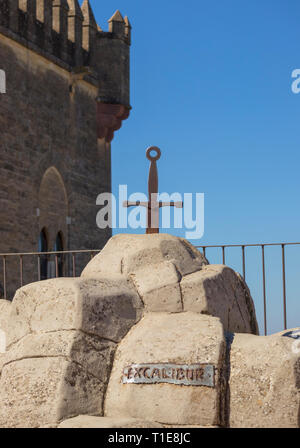 Excalibur.  A recreation of the sword in the stone of the Arthurian legend.  On display in Almodovar castle,  Almodovar del Rio, Cordoba Province, Spa Stock Photo