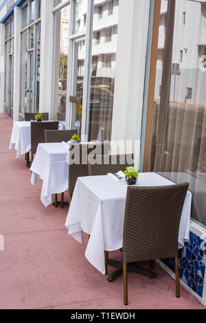 Miami Beach Florida,street,sidewalk cafe,restaurant restaurants food dining cafe cafes,empty,tables,tablecloth,al fresco,al fresco sidewalk outside ta