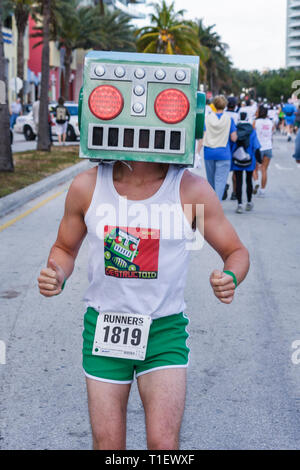 Miami Beach Florida,Ocean Drive,South Pointe 5K Run,benefit,charity,runners,running,race,compete,man men male,mask,Destructoid,video gamer community,s Stock Photo