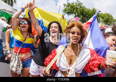 Miami Florida,Little Havana,Calle Ocho,festival,street fair,Hispanic,Black,girl girls,youngster,female kids children girls,woman female women,teen tee Stock Photo