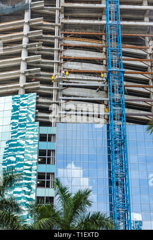 Miami Florida,under new construction site building builder,project,building,architecture crane,skyscraper,office building,aerial platform,men,workers, Stock Photo