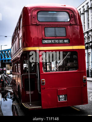 London, United Kingdom: a retro double decker bus is waiting in a station. Stock Photo