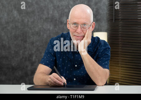 a senior designer using graphic tablet at office Stock Photo
