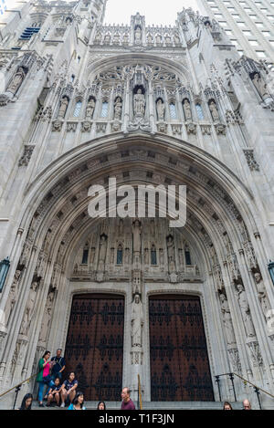 New York City, USA - July 28, 2018: Facade of The Saint Thomas Church on Fifth Avenue (5th Avenue) with people around in Midtown Manhattan, New York C Stock Photo