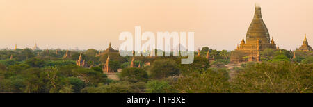 Stunning panoramic view of the Bagan ancient city (formerly Pagan) during sunset. The Bagan Archaeological Zone is a main attraction in Myanmar. Stock Photo