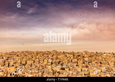 Amman, Jordan, view of the old city, a large complex of decaying buildings overlooking the citadel located on Jabal Al Qal'a. Kites in the sky. Stock Photo