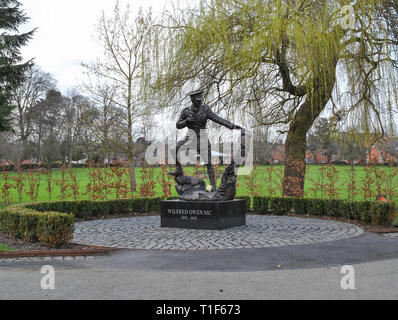 A statue of Wilfred Owen in Oswestry's Cae Glas town park Stock Photo