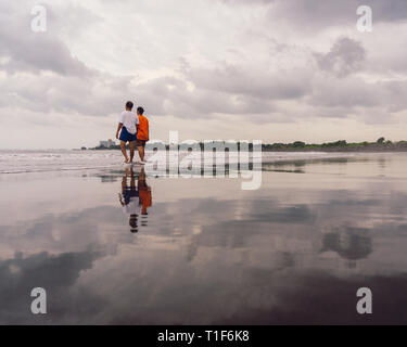 Old women walks on the beach Stock Photo - Alamy