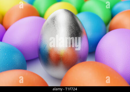 Silver egg in centre, easter eggs, pastel color, multi color eggs: pink, blue, green, orange, yellow. Concept easter egg hunt in sunday. Easter symbol Stock Photo