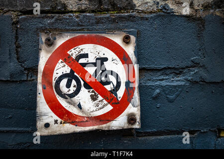 Small wall mounted No Cycles sign and symbol saying no bikes near canal in Kings Cross Stock Photo