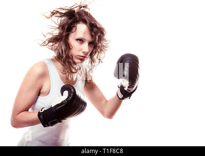 Martial arts. Sport boxer woman in black gloves. Fitness girl training kick boxing isolated on white. Studio shot. Stock Photo
