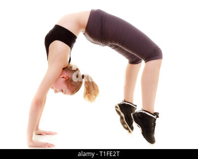 Full length young sporty woman fit fitness sport girl training doing stretching exercise, arched the back head over heels isolated on white background Stock Photo
