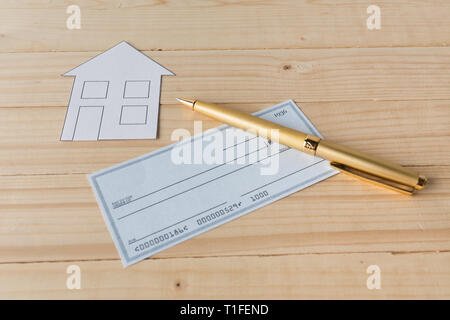 Banking Check with magnifier glass Stock Photo