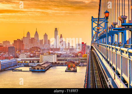 Philadelphia, Pennsylvania, USA downtown skyline from the Benjamin Franklin Bridge at twilight. Stock Photo