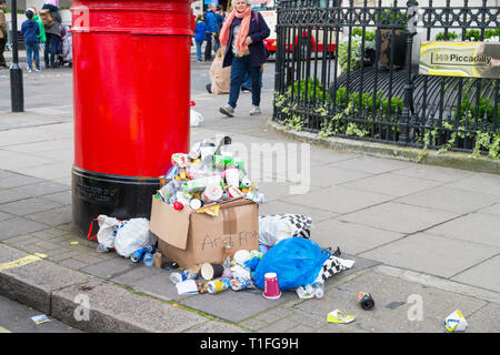 Piles of rubbish left on the side of a london road after a march in london, uk Stock Photo
