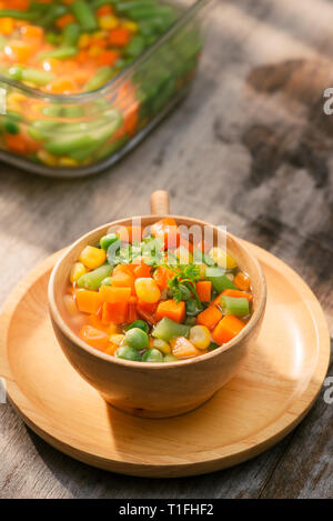 Steamed Organic Vegetable Medly with Peas, Corn, Beans, and Carrots Stock Photo