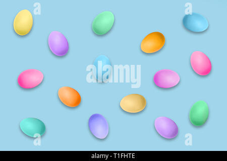 Pastel colored Easter eggs on blue background, Easter pattern Stock Photo