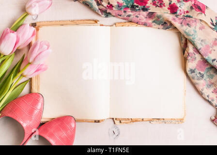 empty book on a pink table