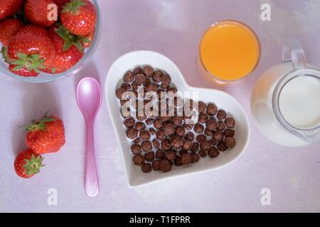 Strawberries in a heart bowl, chocolate and mint Stock Photo - Alamy