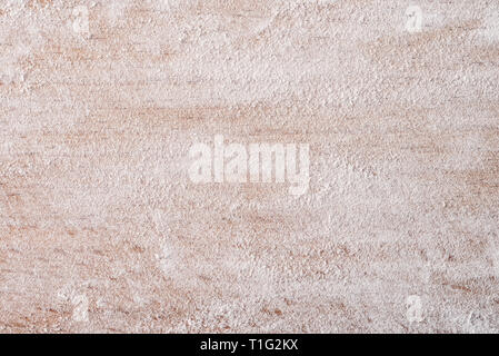 Close up of wheat flour on wooden board Stock Photo