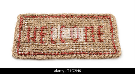 Traditional natural braided door mat isolated on white Stock Photo