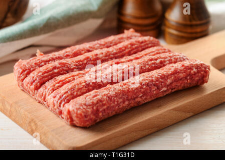Close up of row of fresh raw beef kebabs Stock Photo