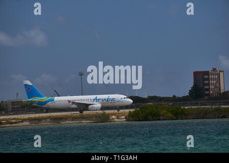Plane landing in Aruba Airport Stock Photo